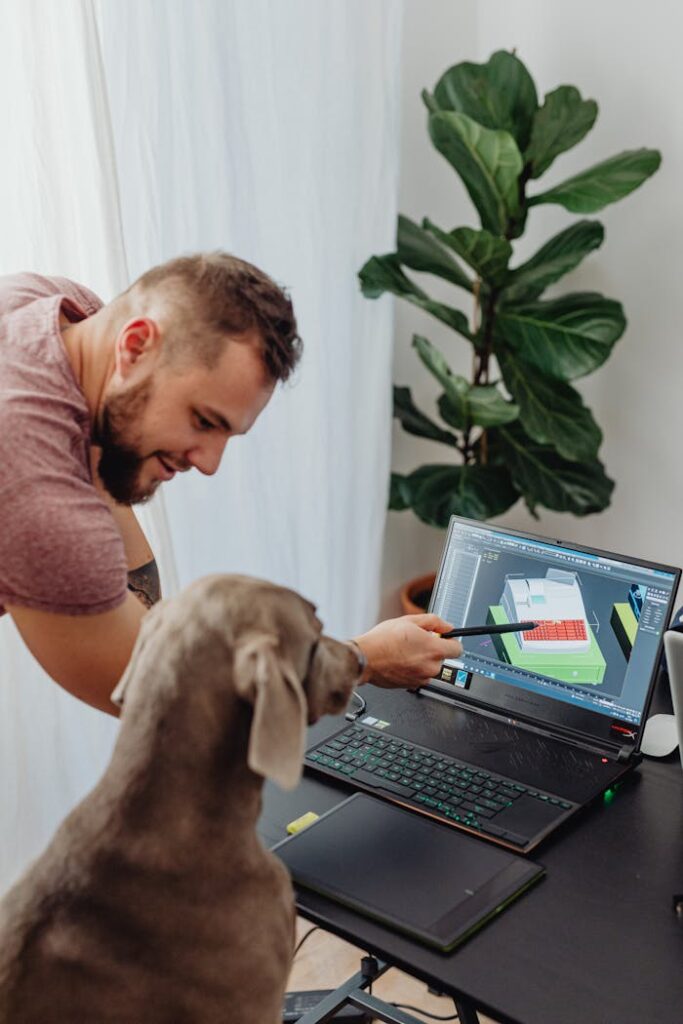 Shot of a Man Giving Instruction on Computer Screen To a Dog